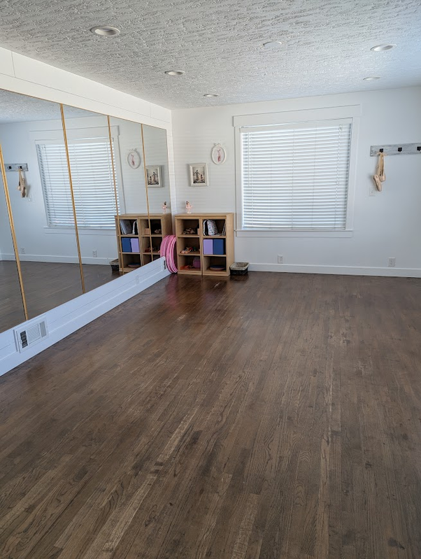 The Graceful Steps home dance studio with mirrors and a wood floor
